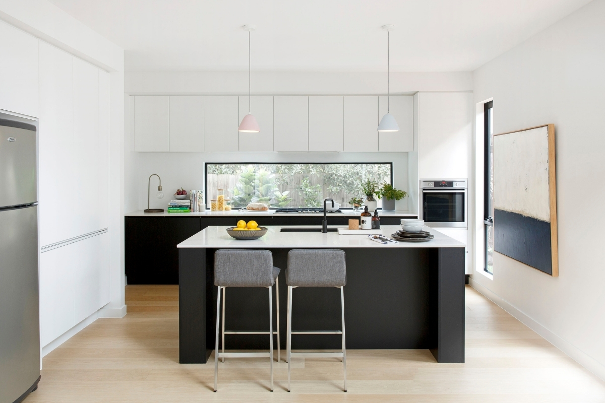 Black and white L-shaped kitchen