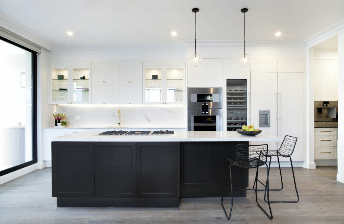 Apartment 4- Julia and Sasha Freedom Kitchen Black and white galley kitchen with island