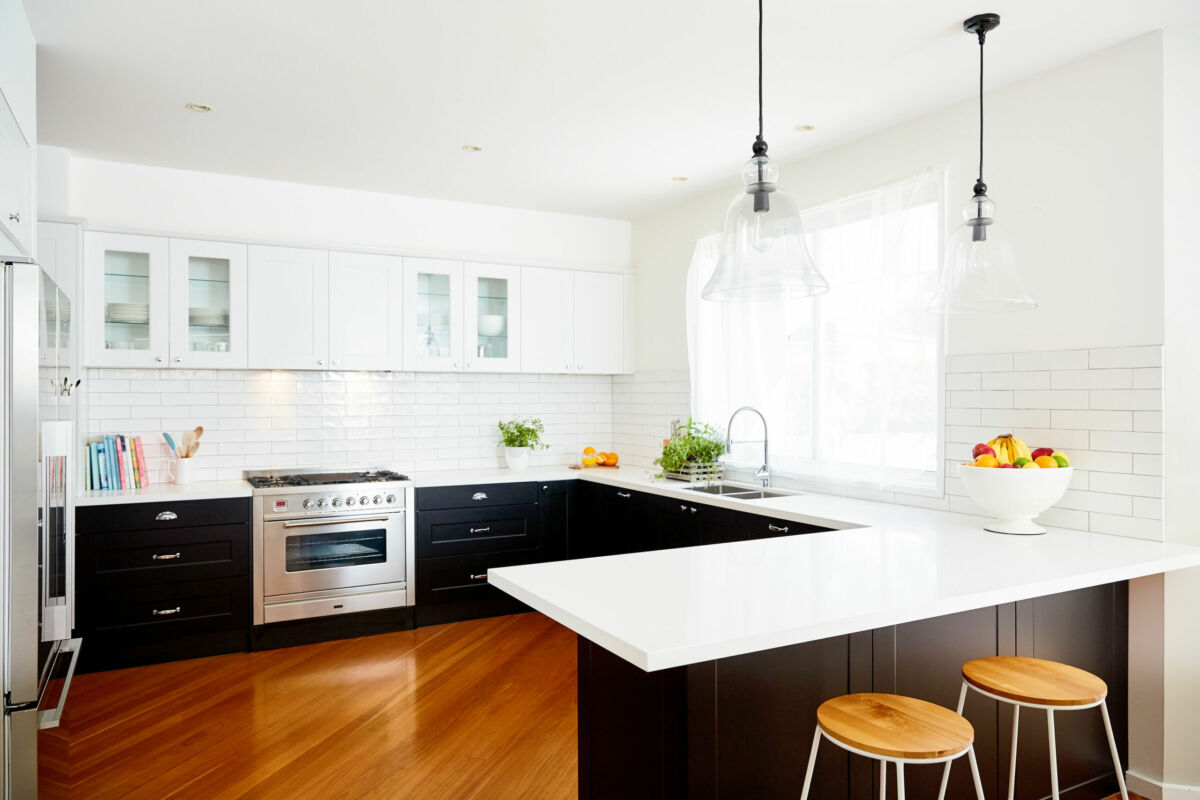 KM Kitchen Black and white u-shaped shaker-style kitchen