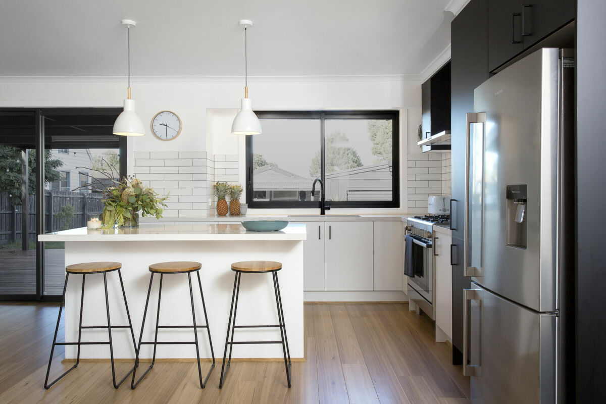 Black and white L-shaped kitchen